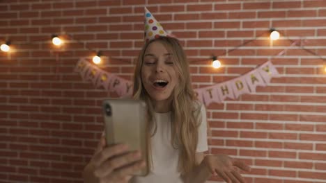 Excited-girl-shout-Happy-Birthday-on-smartphone's-camera