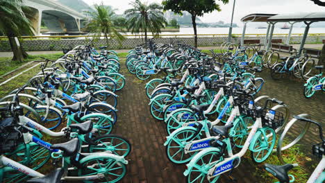 Hong-Kong-City-Bikes-in-Motion:-Slow-Motion-Gimbal-Shot-of-Shared-Bicycle-Parked-Fleet