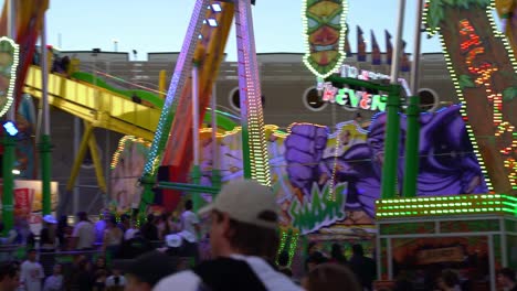 Popular-carnival-ride,-the-beast-swinging-pendulum-ride,-passengers-swinging-back-and-forth-in-high-speed-with-excitements-and-adrenaline-rush-at-Ekka-Royal-Queensland-Show,-Brisbane-Showgrounds