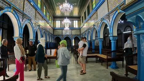 Slow-motion-of-tourist-at-El-Ghriba-Jewish-synagogue-of-Djerba-in-Tunisia