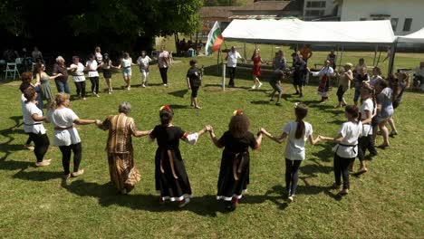 National-flag-waves-as-dancers-perform-a-circle-at-cultural-festival