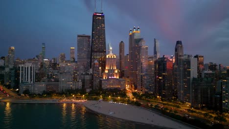 Chicago-IL-USA-Cityscape-Skyline-at-Night,-Aerial-View-of-Towers-in-Lights-and-Traffic-on-Lake-Shore-Drive