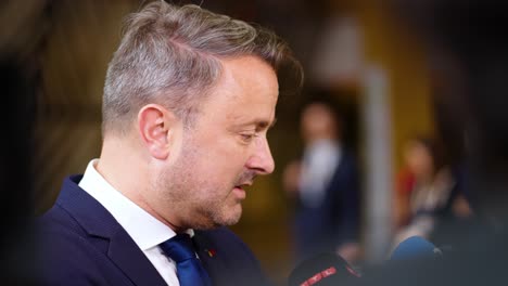 Prime-Minister-of-Luxembourg-Xavier-Bettel-talking-to-the-press-at-the-EU-Council-summit-in-Brussels,-Belgium---Slow-motion-shot