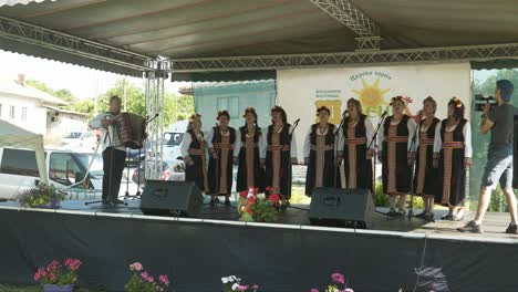 Elderley-Ladies-folk-choir-filmed-performing-on-summer-festival-stage