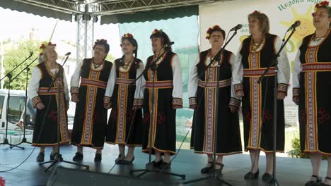 Ladies-folk-choir-sing-perform-on-stage-at-traditional-summer-event