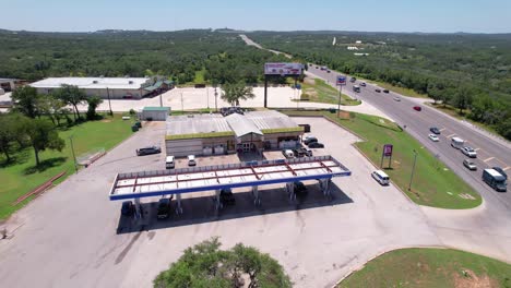 Editorial-Aerial-footage-of-a-Chevron-and-Pale-Face-Grocery-store-in-Spicewood-Texas
