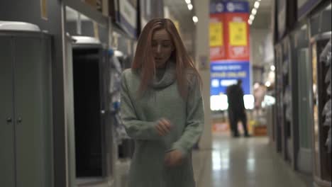 Woman-dances-in-hardware-store-between-the-rows