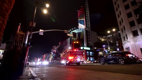 Tiller-firetruck-driving-the-streets-of-Los-Angeles-to-the-scene-of-an-emergency-at-night