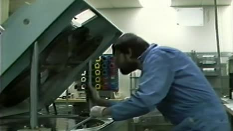 1980S-TECH-WORKING-ON-SILICON-WAFER-CHIP