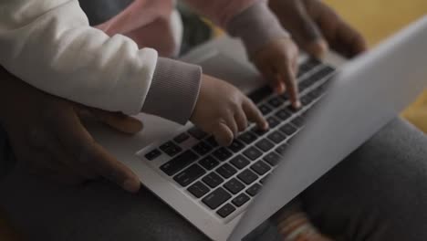 Black-father-and-small-boy-learning-computer-at-home-for-child-education,-close-up