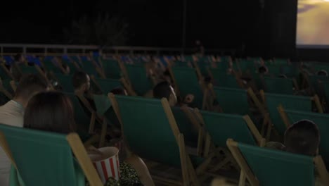 Modern-open-air-cinema-with-comfortable-seats-in-public-park-or-beach