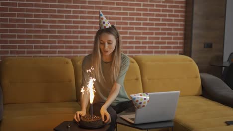 Blonde-attractive-woman-celebrating-distant-birthday-online-with-friends-videochat-conference-laptop