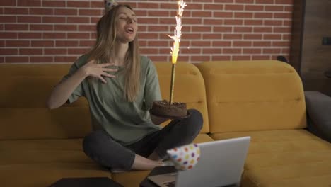 Positive-woman-celebrating-distant-birthday-online-with-friends-video-chat
