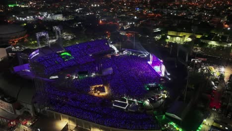 Hyperlapse-drone-shot-around-the-Estadio-Quisqueya,-concert-night-in-Santo-Domingo