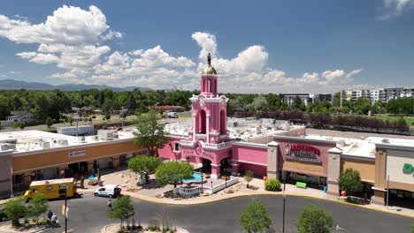 Popular-pink-Casa-Bonita-Mexican-restaurant-in-Lamar-Station-Plaza,-drone-view
