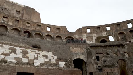Looking-Up-Across-The-Podium,-Maenianum-Primum,-Secundum-And-Summum-in-ligneis-Inside-The-Colosseum