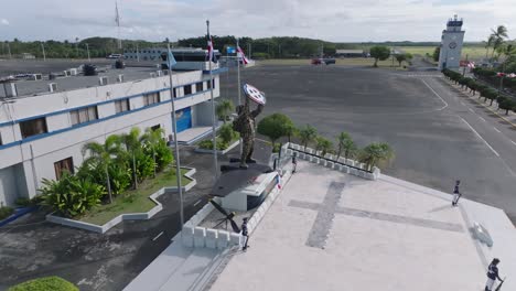 Aerial-orbit-shot-showing-soldier-statue-at-San-Isidro-Air-Base-in-Santo-Domingo