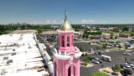 Aerial-orbit-and-pullback-view-from-iconic-pink-tower-of-Casa-Bonita,-Lakewood