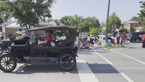 Old-car-driving-by-at-parade