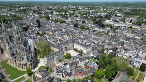 Bayeux-town-in-France-hgh-panning-drone,-aerial-4K-footage