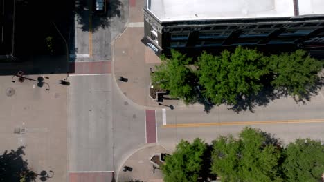 Downtown-Rock-Island,-Illinois-with-drone-video-overhead-intersection-with-car-turning