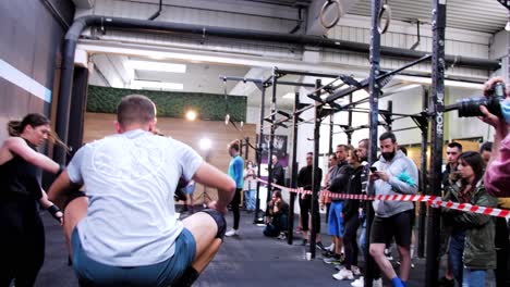Energetic-male-athlete-jumps-with-agility-and-power-onto-a-CrossFit-box