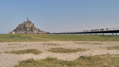 View-of-the-bridge-and-the-medieval-abbey-of-Mont-Saint-Michel-in-France