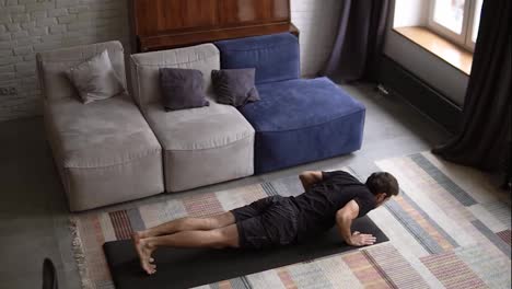 Slow-motion-footage-of-a-man-doing-push-up-exercise-at-home