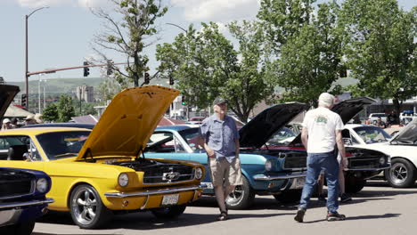 Men-Walking-Around-Classic-Cars-With-Open-Hoods-At-The-Applebee's-And-The-Street-Rodders-For-Life-Charity-Car-Show