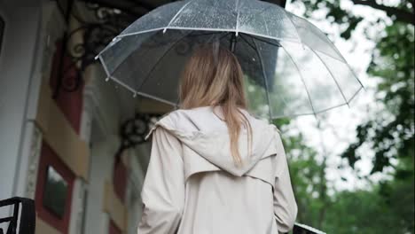 Blonde-woman-going-upstrairs-to-hide-from-the-rain