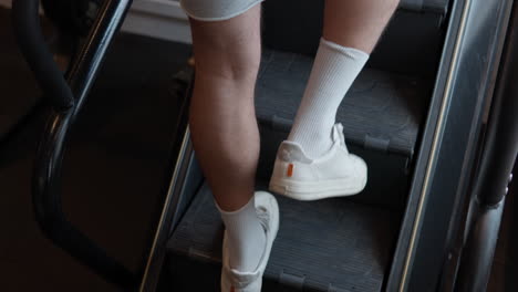 Man-Feet-or-Legs-Doing-Cardio-on-Stair-Machine-at-Gym