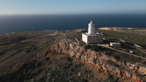Aerial-view-of-Lighthouse-in-Gozo-bird-is-flying