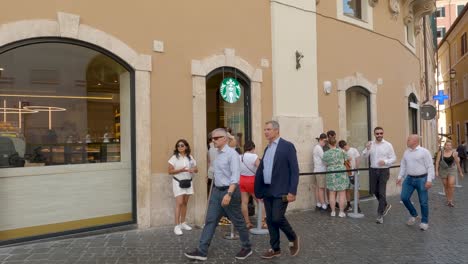 People-Waiting-in-line-at-the-First-Starbucks-in-Rome,-Italy