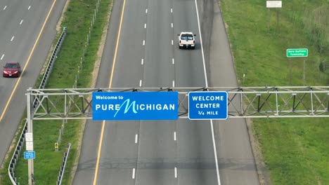 Welcome-to-Pure-Michigan-road-sign-above-interstate-highway