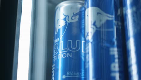 Close-up-of-Red-Bull-cans-in-a-fridge-with-blueberry-flavor