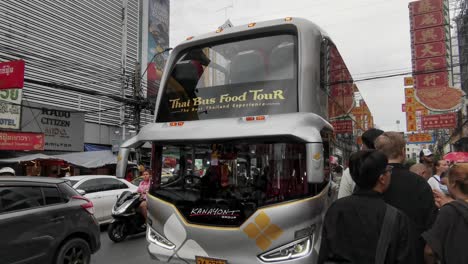 Thai-Bus-Food-Tour-Passing-Looking-Inside-Along-Yaowarat-Road-in-Chinatown,-Bangkok