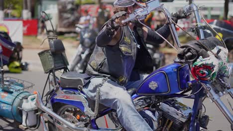 motorcycle-stunts,-biker-gang-member,-riding-his-Harley-Davidson,-ride-motorcyclist,-motorcycle-gang
