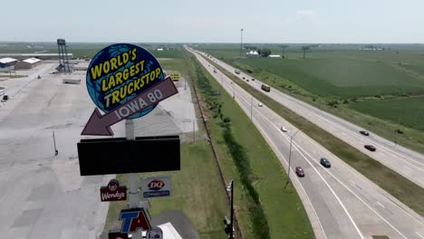 World's-largest-truck-stop-along-I-80-freeway-in-Walcott,-Iowa-with-drone-video-stable