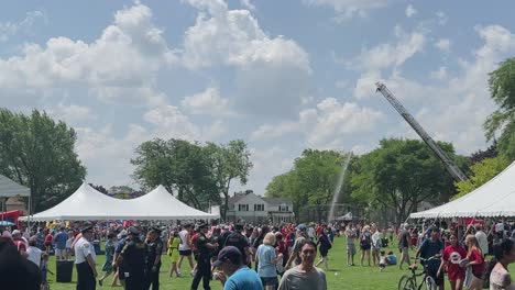 Firetruck-cooling-festival-attendees-on-a-hot-day