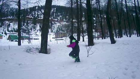 girl-enjoying-snow-walking-adventure-at-snow-cap-mountains-at-day-video-is-taken-at-manali-at-himachal-pradesh-india-on-Mar-22-2023