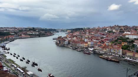 Porto,-Portugal-from-above-overlooking-Dom-Luis-1-bridge,-Douro-river-and-Porto-city