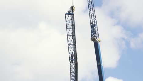 10-July-2023,-Riga,-Latvia:-Workers-Seting-Up-Crane-in-Big-Hight