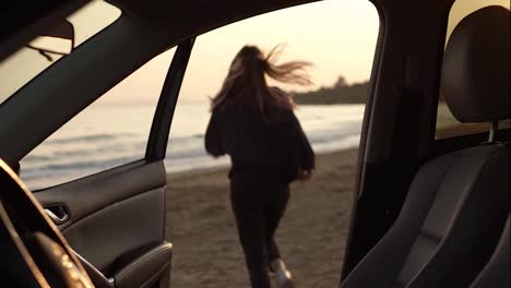 Woman-in-motion-of-relax-running-from-car-through-the-sea-beach,-feel-exciting-on-sea-beach