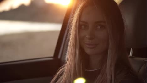 Beautiful-woman-lookingto-the-camera-from-the-car-then-go-out-from-the-car-seat-to-the-seashore