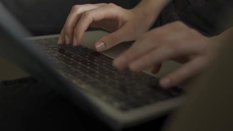 Close-up-of-female's-hands-typing-on-laptop