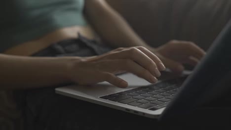 Close-up-of-female's-hands-typing-on-laptop's-keyboard