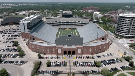 Kinnick-stadium-on-the-campus-of-the-University-of-Iowa,-home-of-the-Iowa-Hawkeyes-in-Iowa-City,-Iowa-with-drone-video-pulling-back-and-up
