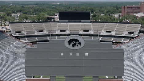 Kinnick-stadium-on-the-campus-of-the-University-of-Iowa,-home-of-the-Iowa-Hawkeyes-in-Iowa-City,-Iowa-with-drone-video-moving-in-and-down-parallax