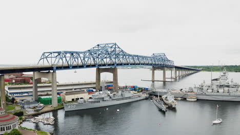 Wide-aerial-view-of-Battleship-Cove-and-the-decommissioned-warships-at-Braga-Bridge-in-Fall-River-Massachusetts