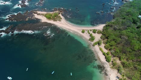 Costa-Rica-San-Juanillo-Beach-Aerial-Drone-Flight-Over-Blue-Ocean-And-Sandy-Shore-Headland,-4K